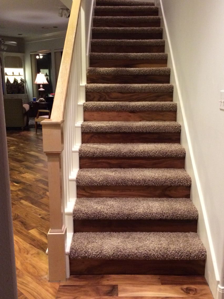 Hickory flooring risers with carpet treads to transition from downstairs wood flooring to upstairs carpet.