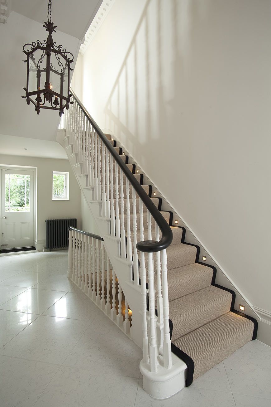 Holland Park original staircase with French polished banister and stair runner and marble hallway of period home