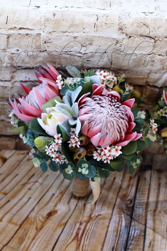 Rustic bridal bouquet, bridesmaid bouquet.  King protea, garden roses, wax flower, billy buttons, blushing bride, wax flower, native foliage