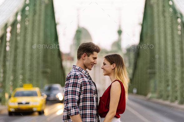 Young loving couple hugging in the street. by nunezimage. Young loving couple hugging in the street. Young Love Concept. #AD #couple, #hugging, #Young, #loving