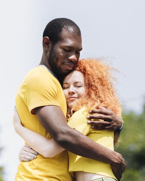 Download Side View Of Interracial Couple Hugging For Free